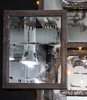 Detail of vintage mercury mirror installation made from medicine chests collected from historic Birmingham Hotel renovation. Made by the Funktion Art Design Compound, a local collective that up-cycles and re-imagines architectural accents. Photo 9 of Studio GoodLight modern home