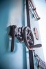 Rear view of custom pivot door made from up-cycled clock parts and repurposed
metal components that function to lock up. Designed and crafted by the FunktionArt Design Compound. Photo 12 of Studio GoodLight modern home