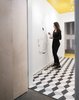 artist Gabrielle Bates Stahlman (Liesa Cole's daughter) painting a poetry comic mural in the studio bathroom Photo 14 of Studio GoodLight modern home