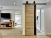 Modern home with Bookcase, Recessed Lighting, Light Hardwood Floor, Shelves, Ceiling Lighting, Bench, and Bedroom. Master Bedroom - barn slider fabrication by Davey McEathron Architecture Photo 3 of POLO PROJECT