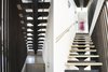 Modern home with Staircase, Metal Railing, and Metal Tread. Stair railing fabrication by Brian Chilton Design Photo 3 of East 9th House