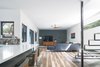 Modern home with Living Room, Sofa, Console Tables, Coffee Tables, Ceiling Lighting, and Medium Hardwood Floor. Living Space Photo 7 of Norris House
