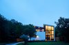 Modern home with Exterior, Shed RoofLine, Metal Roof Material, Wood Siding Material, Stucco Siding Material, and House Building Type. Exterior Dusk Shot Photo 15 of Chelsea House