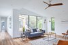 Modern home with Living Room, Coffee Tables, Chair, Accent Lighting, End Tables, Sofa, Ceiling Lighting, and Medium Hardwood Floor. Upstairs Living Area Photo 8 of Chelsea House