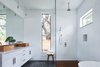 Modern home with Bath Room, Pendant Lighting, Porcelain Tile Floor, Enclosed Shower, Freestanding Tub, Engineered Quartz Counter, Full Shower, Subway Tile Wall, and Vessel Sink. Davey McEathron Architecture installed slim windows to provide a light-filled, yet private, master bathroom in Chelsea House. Photo 7 of Chelsea House