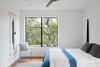 Modern home with Bedroom, Chair, Ceiling Lighting, Bed, and Medium Hardwood Floor. Bedroom 1 Photo 6 of Chelsea ADU