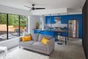 Modern home with Kitchen, Concrete Floor, Engineered Quartz Counter, Refrigerator, Cooktops, Range, Subway Tile Backsplashe, Ceiling Lighting, Colorful Cabinet, Pendant Lighting, Drop In Sink, and Microwave. Living Area and Kitchen Photo 3 of Chelsea ADU