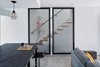 Modern home with Staircase, Wood Tread, and Metal Railing. Stair Guard custom fabricated by Davey McEathron Architecture Photo 4 of Chelsea ADU