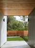 Modern home with Outdoor, Hardscapes, Wood Fences, Wall, Front Yard, Shrubs, Walkways, Grass, Horizontal Fences, Wall, Small Patio, Porch, Deck, and Trees. Dogtrot Photo 9 of Chelsea ADU