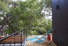 Modern home with Outdoor, Wood Fences, Wall, Horizontal Fences, Wall, Small Patio, Porch, Deck, Wood Patio, Porch, Deck, Metal Fences, Wall, Metal Patio, Porch, Deck, Decking Patio, Porch, Deck, and Rooftop. Rooftop Deck off Bedroom 02 Photo 7 of Chelsea ADU