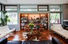 Interior spaces feature Mahogany floors and casework. The thick walls, courtesy of the 12" Rastra Blocks, allow for deep storage niches. Photo 5 of Cedar Mills House modern home