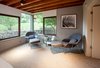 Exposed framing at the ceiling adds warmth to the Master Bedroom. Photo 6 of Cedar Mills House modern home