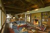 The Great Room contains all the elements of family living within it's length. At the far end the dining area, a kitchen at its center and a living room at the nearest end. Photo 4 of Columbia Gorge House modern home