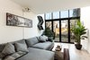 Back wall replaced with floor to above ceiling level glass windows and doors Photo of Brooklyn Railroad Townhouse to Open Plan Renovation modern home