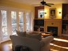 Modern home with Living Room, Medium Hardwood Floor, Ceiling Lighting, Gas Burning Fireplace, Wall Lighting, Bookcase, Media Cabinet, Coffee Tables, and Chair. Living Room Photo 5 of The McCullough Project