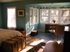 Modern home with Medium Hardwood Floor, Ceiling Lighting, Chair, Bed, Wardrobe, Bookcase, Storage, Dresser, Windows, Double Hung Window Type, and Wood. Master Bedroom Photo 7 of The McCullough Project