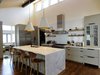 Modern home with Kitchen, Dark Hardwood Floor, Range, Colorful Cabinet, Range Hood, Subway Tile Backsplashe, Quartzite Counter, Refrigerator, Undermount Sink, Wood Cabinet, Pendant Lighting, and Recessed Lighting. This kitchen is magnificent. Photo 13 of The McCarthy Project