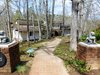 Modern home with Exterior, Shingles Roof Material, Shed RoofLine, House Building Type, Hipped RoofLine, Wood Siding Material, and Gable RoofLine. Exterior front of this Jon Condoret beauty designed and built in 1972 for Mary Anderson and renovated by Actual Size Builders in 2018. Photo of The McCarthy Project