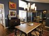 Modern home with Dark Hardwood Floor, Chair, Table, Recessed Lighting, and Pendant Lighting. We swapped the location of the dining and kitchen, and converted the existing mudroom into a wine cellar with frameless glass and storage for 750 bottles. Photo 16 of The McCarthy Project