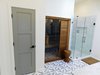 Modern home with Recessed Lighting and Quartzite Counter. Master bath with frameless glass tile shower and cedar spa unit from Sunlighten. Photo 17 of The McCarthy Project
