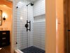Modern home with Wall Lighting, Undermount Sink, Recessed Lighting, Quartzite Counter, and Dark Hardwood Floor. New tile shower with frameless glass door in Jack&Jill bath. Photo 18 of The McCarthy Project
