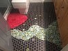 With the passion in bubbles the home owner/designer searched for bubbles tiles and installed them in the kids' bathroom floor with black hexagon tiles as background. Photo 3 of The Bubbles House modern home
