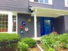 Dark gray exterior color with white trims make the house stand out in this colonial style residential neighborhood. Glass wall art were made by Wolf Art Glass. Photo 18 of The Bubbles House modern home