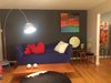 Home owners collect art work over the years from different cities and the living room and dining room serve as a gallery for those art. Photo 11 of The Bubbles House modern home