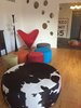 The circle holes in the wall were first meant to be aesthetic but they also serve the home owners' need to bring in sun light to the star case. Photo 2 of The Bubbles House modern home