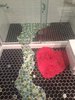 The bubble tiles extend to the shower stall floor and to the wall to demonstrate the rising bubbles. Photo 4 of The Bubbles House modern home