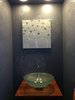 Powder room with dark gray wall and silver circle pattern make the small powder room seem big. Photo 15 of The Bubbles House modern home