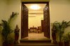 Entrance door having brass flowers and heavy wooden hand craving Photo 3 of SURAJ - BUNGALOW modern home