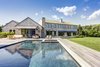 Modern home with Outdoor, Back Yard, Trees, Shrubs, Gardens, Grass, Large Pools, Tubs, Shower, Swimming Pools, Tubs, Shower, Salt Water Pools, Tubs, Shower, Walkways, Wood Patio, Porch, Deck, Planters Patio, Porch, Deck, Landscape Lighting, and Large Patio, Porch, Deck. Saltwater pool with integrated jacuzzi. Photo 9 of Jagger Lane