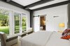 Modern home with Bedroom, Bed, Table Lighting, Dresser, Night Stands, Chair, Lamps, Accent Lighting, Light Hardwood Floor, and Rug Floor. Master House Master Suite Photo 14 of North Haven Compound