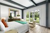 Modern home with Bedroom, Bed, Dresser, Chair, Ceiling Lighting, Light Hardwood Floor, and Table Lighting. Main House Master Suite Photo 4 of North Haven Compound