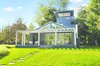Modern home with Exterior, House, Metal Siding Material, Metal Roof Material, and Wood Siding Material. Guest Cottage Exterior Photo 5 of North Haven Compound