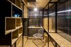 Modern home with Office, Lamps, Chair, Shelves, Bookcase, Storage, Craft Room Room Type, Desk, and Plywood Floor. Minima Moralia at London Festival of Architecture 2016 - internal space Photo 4 of Minima Moralia