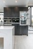 Modern home with Kitchen, Wall Oven, Wood Cabinet, Marble Counter, Light Hardwood Floor, Refrigerator, and Recessed Lighting. Atlanta Design Economy Credits
Architecture: Jeffrey Bruce Baker
Hard surface and cladding material manufacturer: Neolith Photo 3 of Neolith Tiny House