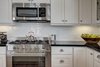 The kitchen has been completely redone to keep up with the modern lifestyle of the owners. Photo 6 of Madrona Victorian modern home