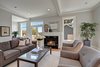 The living room is a comfortable space with gorgeous double hung windows that take advantage of the beautiful view of the outside. Photo 7 of Madrona Victorian modern home