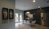 The dining room is essentially an extension of the kitchen, providing ample space for entertaining without feeling too cavernous when the family is eating without company. Photo 4 of Eave House modern home
