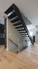 Open risers and glass railings maintain an open flow of space. Photo 5 of Eave House modern home