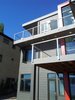 This modern home uses color and pattern to help distinguish the variations in form and provide views of the lake from all rooms. Photo of Lake Washington Home modern home