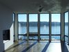 The windows in this house extend from floor to ceiling in order to maximize light and views. Photo 6 of Lake Washington Home modern home