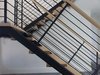 This modern steel stair features wood treads spanning between steel channels. Steel rods are provided instead of the standard cable rail. Photo 7 of Lake Washington Home modern home
