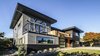 The previous house, obstructed by various plants, was adequate but unremarkable. After the remodel, the new home is almost unrecognizable! Photo of Mod Remodel modern home