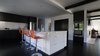 The majority of the kitchen is black and white but bright pops of color keep it modern and fresh. Photo 3 of Mod Remodel modern home