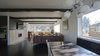 The open living room is both visually and functionally inviting by offering direct connections to the entry, stair, and kitchen beyond. Photo 5 of Mod Remodel modern home