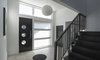 The interior of the home is filled with unique touches like circular windows and lamps grounded in a classic black and white color scheme that make the house stylish without being kitschy. Photo 7 of Mod Remodel modern home