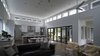 High ceilings were a priority for the clients and the clerestory windows create an illusion that extends the ceiling even higher. Direct access to the deck through the glass doors opens the space even further and seamlessly connects one room to another. Photo 2 of Modern Courtyard Home modern home